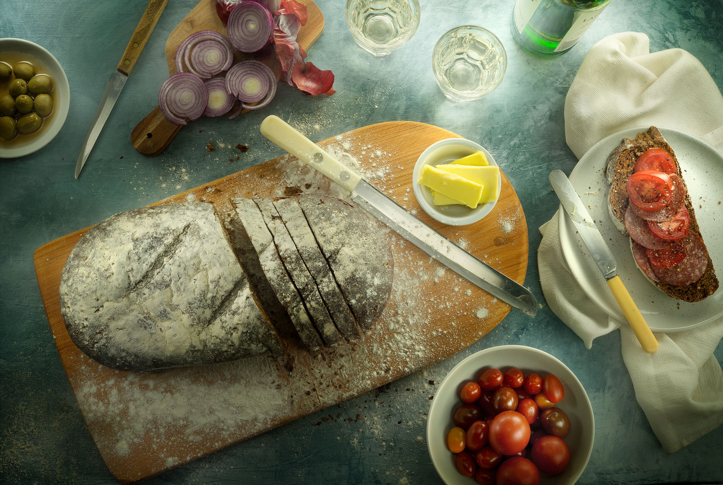 Malt and Rye bread with cherry tomatoes, salami and onions and olives