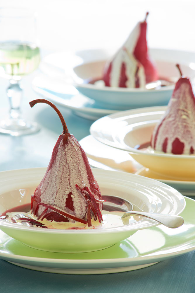 Pears cooked in brandy sauce with cream and lemon rind