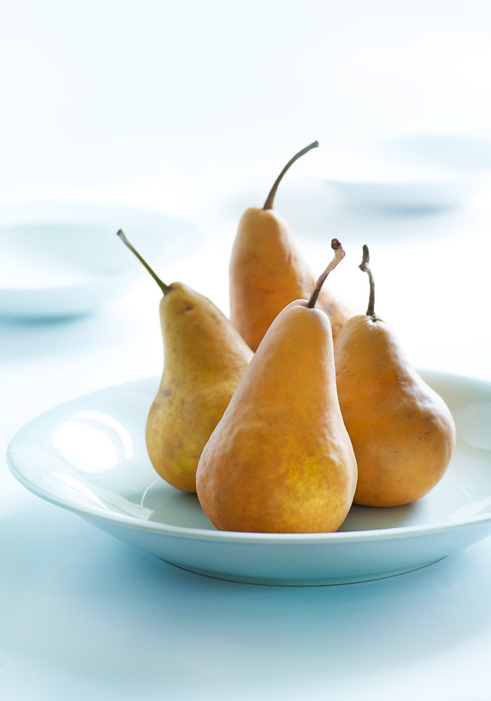 Freah Bosc pears on a white plate