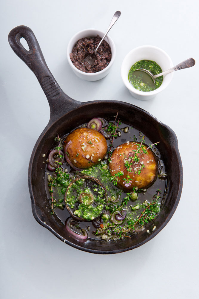 Portobello Mushrooms served in a skillet with thyme, white wine and pesto and tapenade