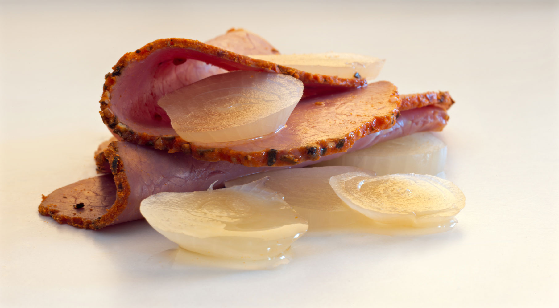 Cold cut meat and pickle onions, photograph