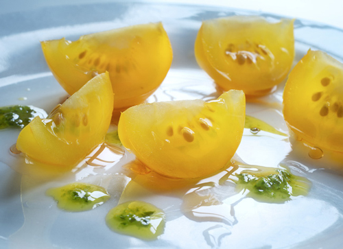 Yellow cherry tomatoes and fresh pesto